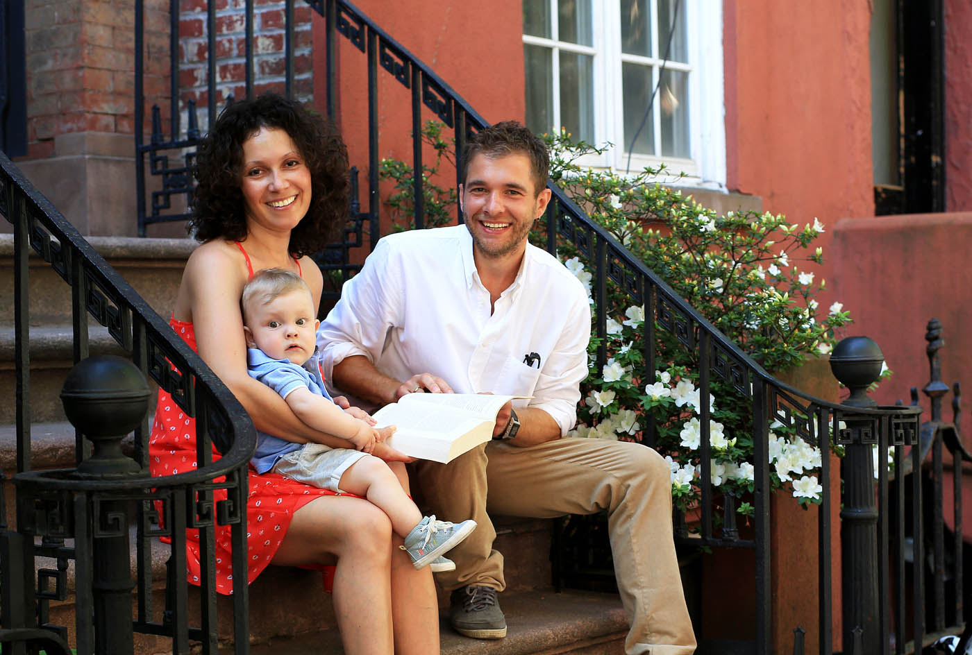 A family sitting on their doorstep in the city - Rest Easy Pest Control Nassau County offers rodent control solutions to protect you and everyone on your property.