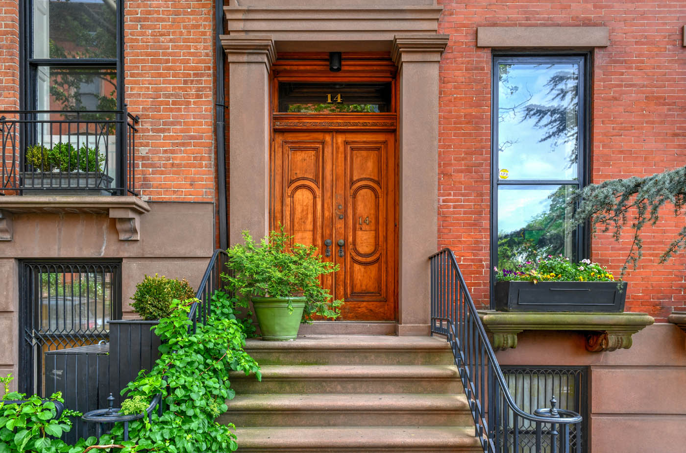 The front door of a home in a city - Rest Easy Pest Control offers expert roach exterminator services in Suffolk County, NY.